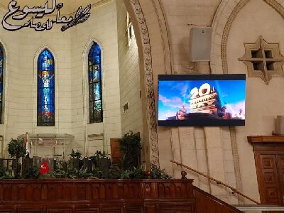 The screen of Fabulux lit up in the church